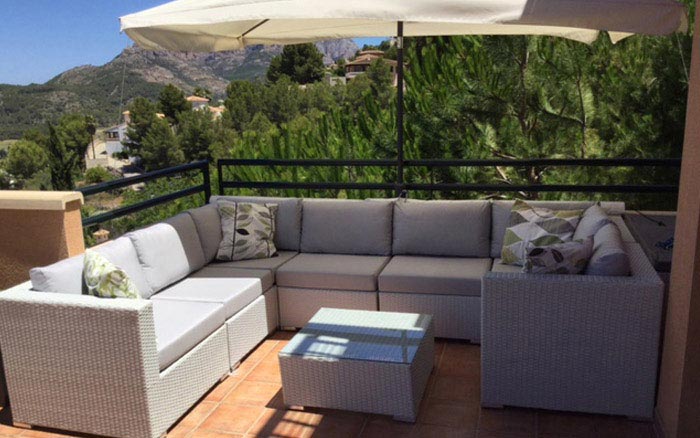 Made-to-measure outdoor furniture cushions for a rattan balcony suite